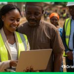 A project manager in Africa using a laptop to demonstrate a digital grievance redress mechanism during a site visit, symbolizing GRM implementation urgency and accountability.