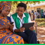 Grievance officer with a tablet helps a Kenyan woman submit a complaint by phone through a digital grievance redress mechanism